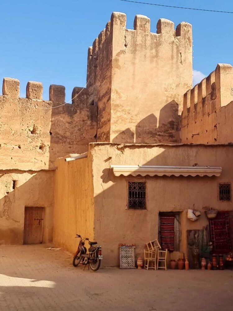 Rugs and handwoven textiles for sale beneath the old kasbah walls, Taroudant